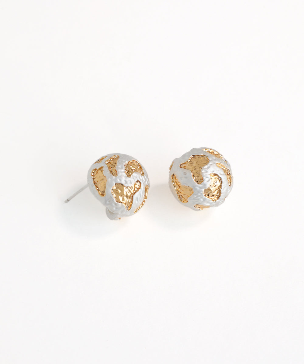 Pair of gold and silver stud earrings on a white background