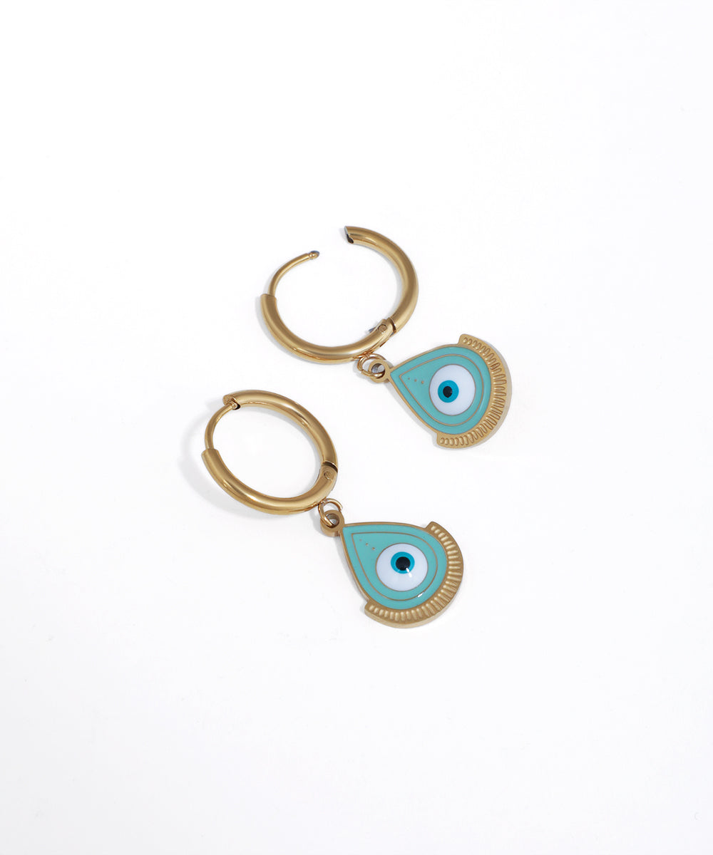 Gold-tone hoop earrings with light blue enamel evil eye charms and textured fan details.