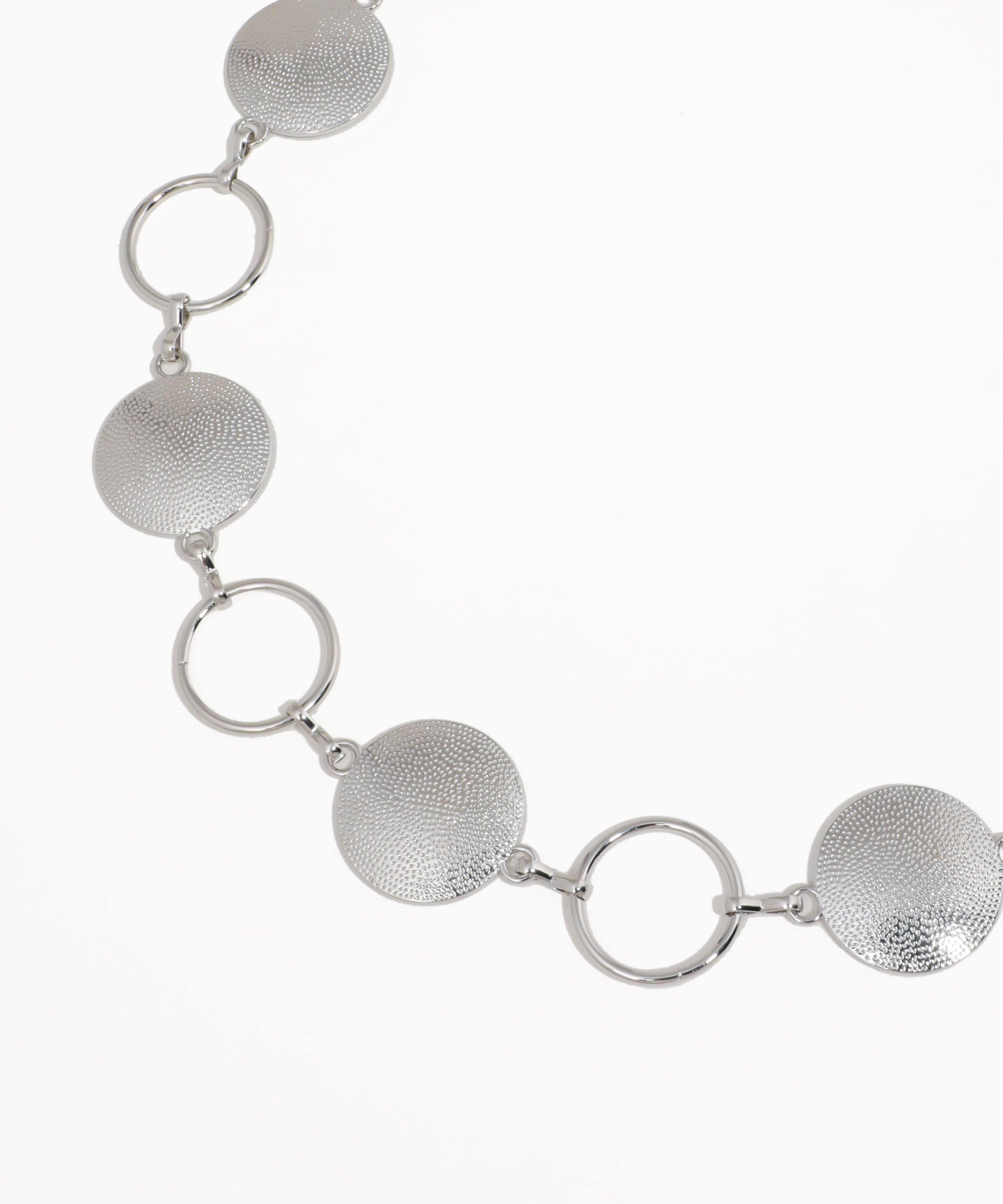 Silver necklace with circular links on a white background