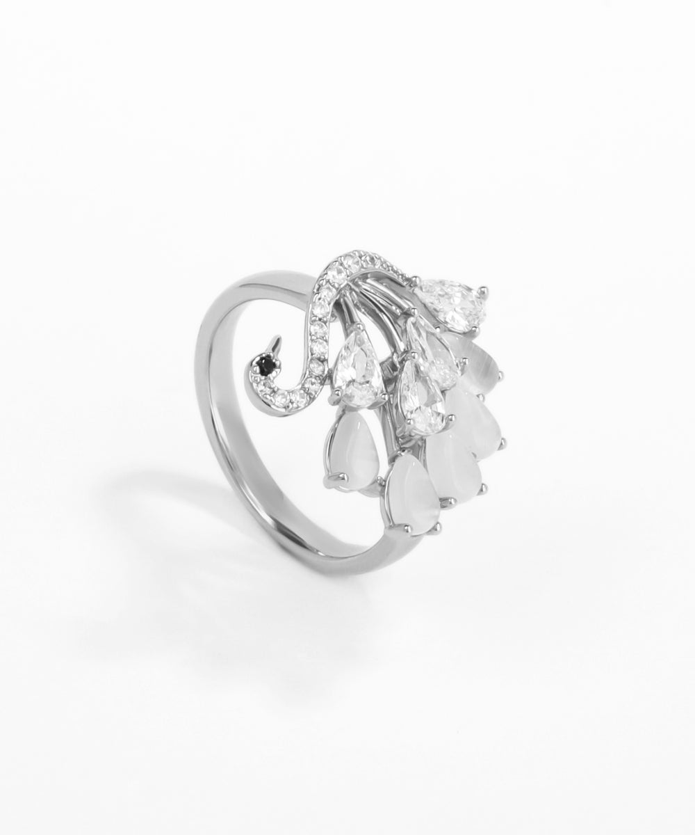 Silver ring with heart-shaped gemstones on a white background