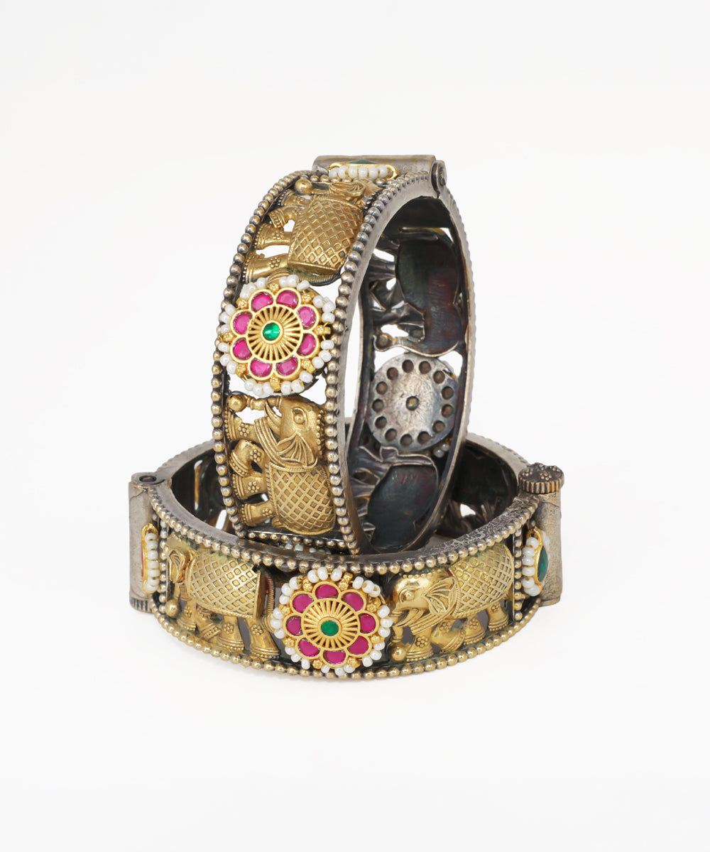 Decorative bracelets with floral and elephant designs on a white background