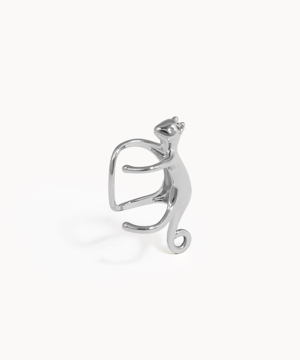 Silver cat-shaped earring on a white background