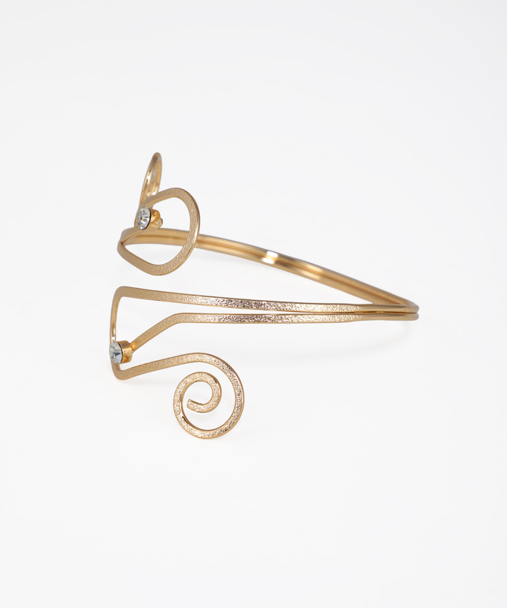 Gold bracelet with spiral design on a white background