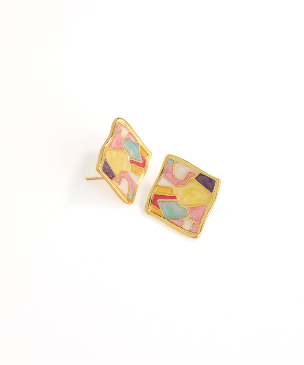 Colorful geometric earrings on a white background