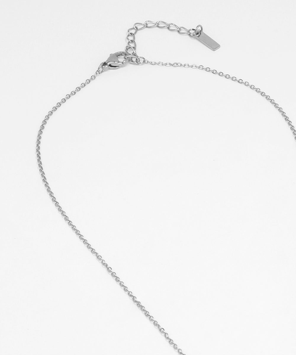 Silver chain bracelet on a light gray background