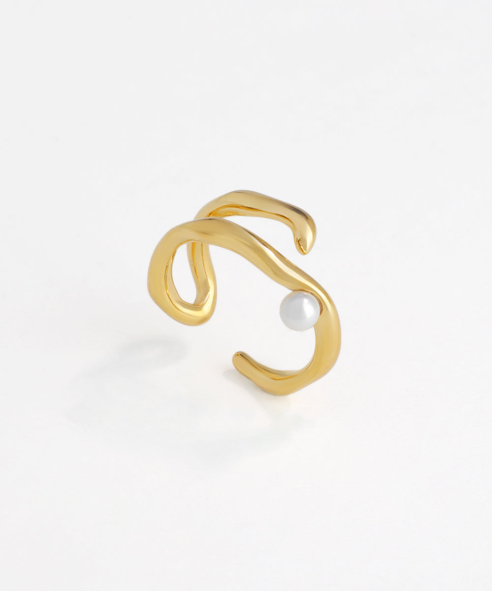 Gold-tone open band ring with fluid wave design and a single pearl