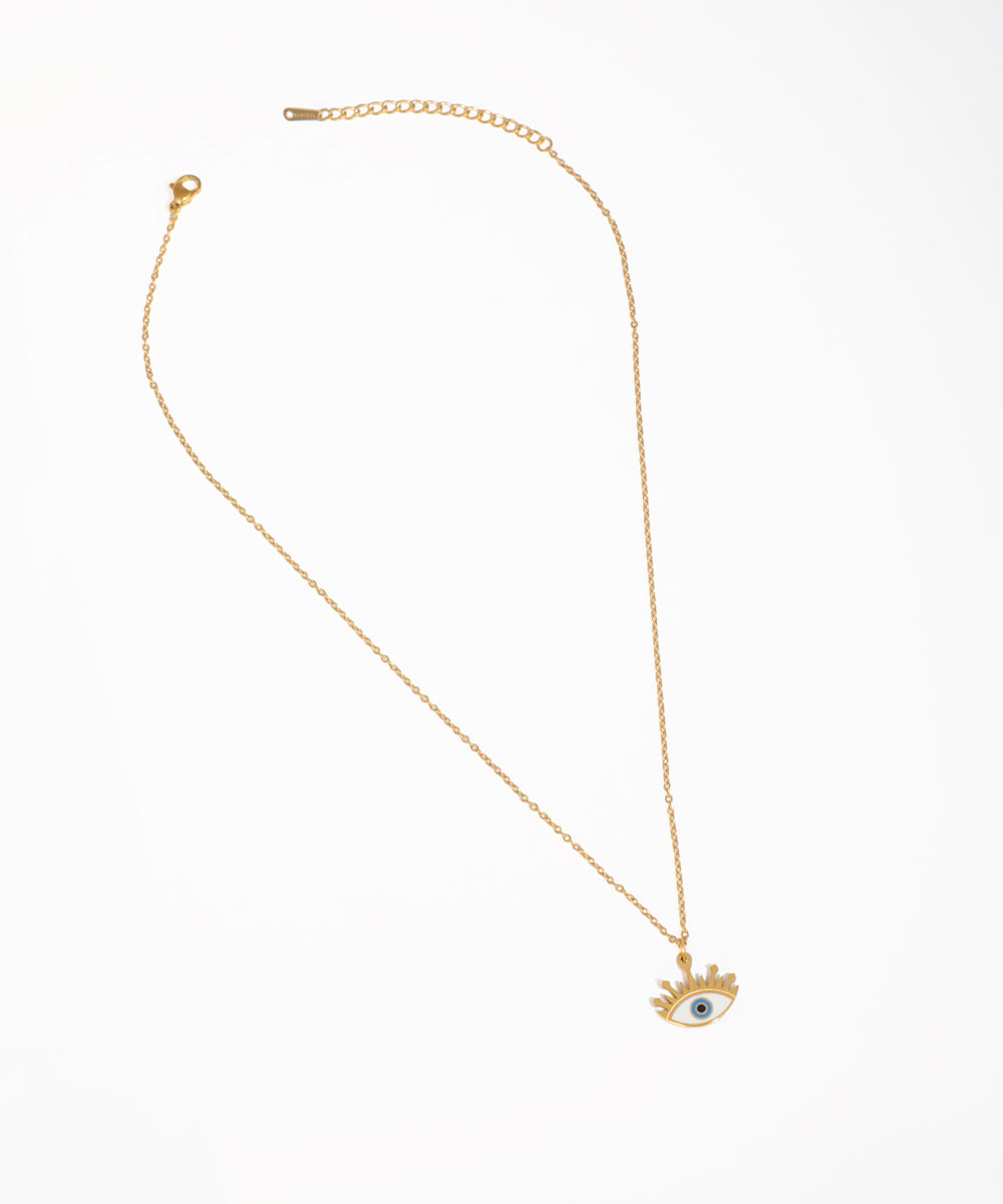 Gold-tone necklace with blue and white evil eye pendant and clear stones
