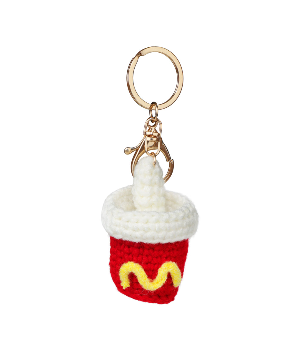 Gold-tone crochet keychain in red and white drink cup design with yellow pattern