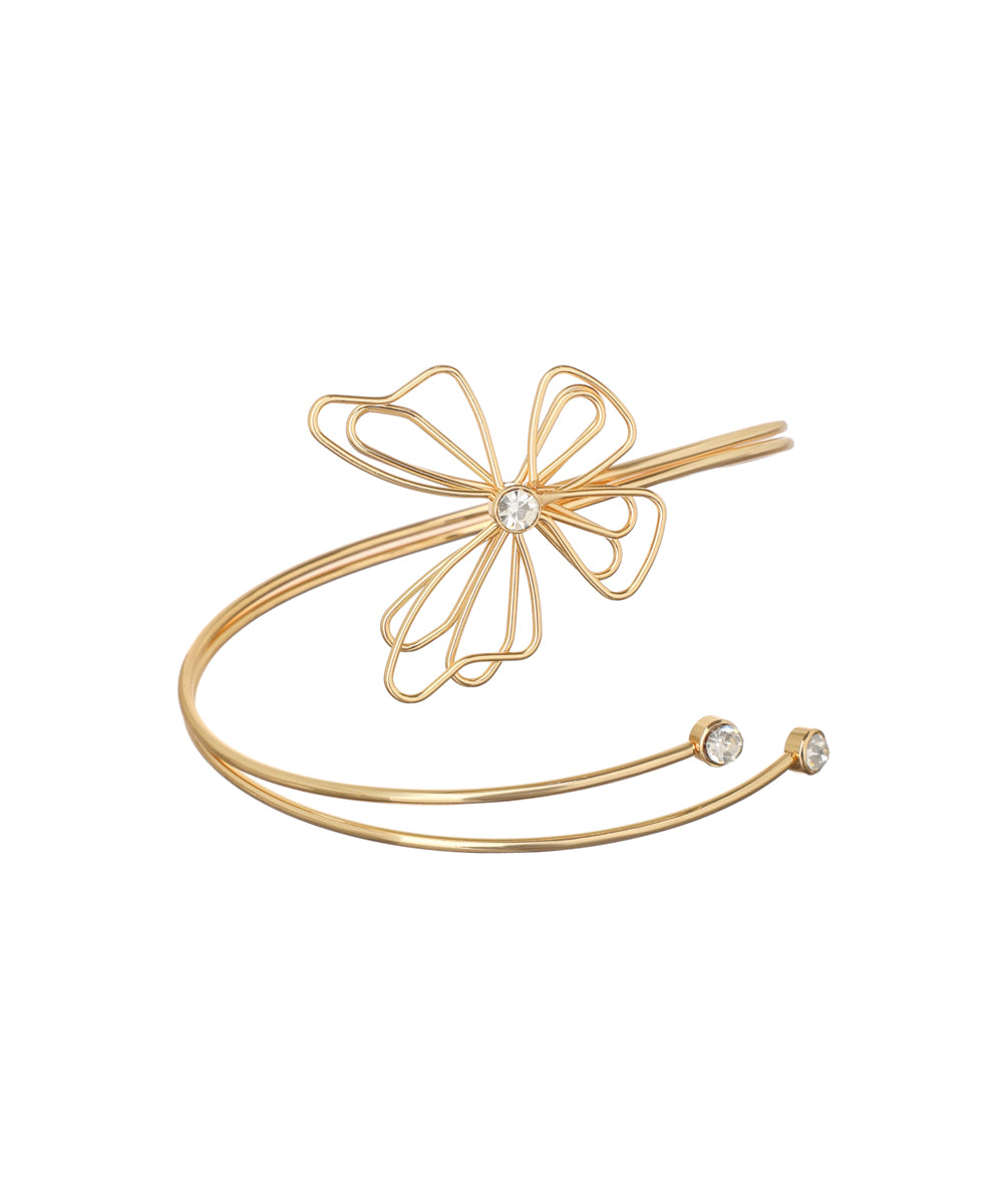 Gold-tone arm cuff with wire flower design and clear stones on open ends
