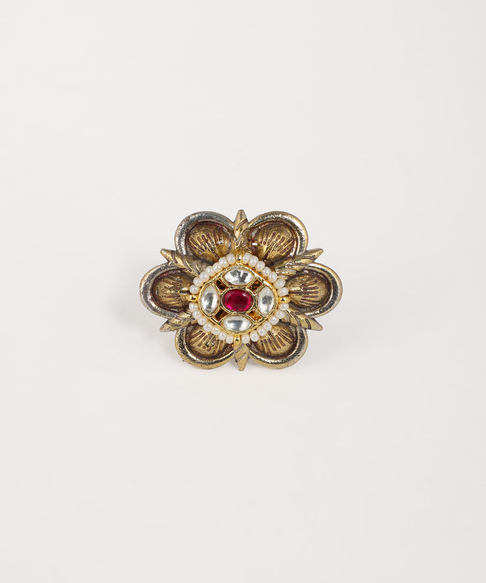 Oxidised gold-tone ring with floral design, red glass crystal, white glass crystals, and faux pearls