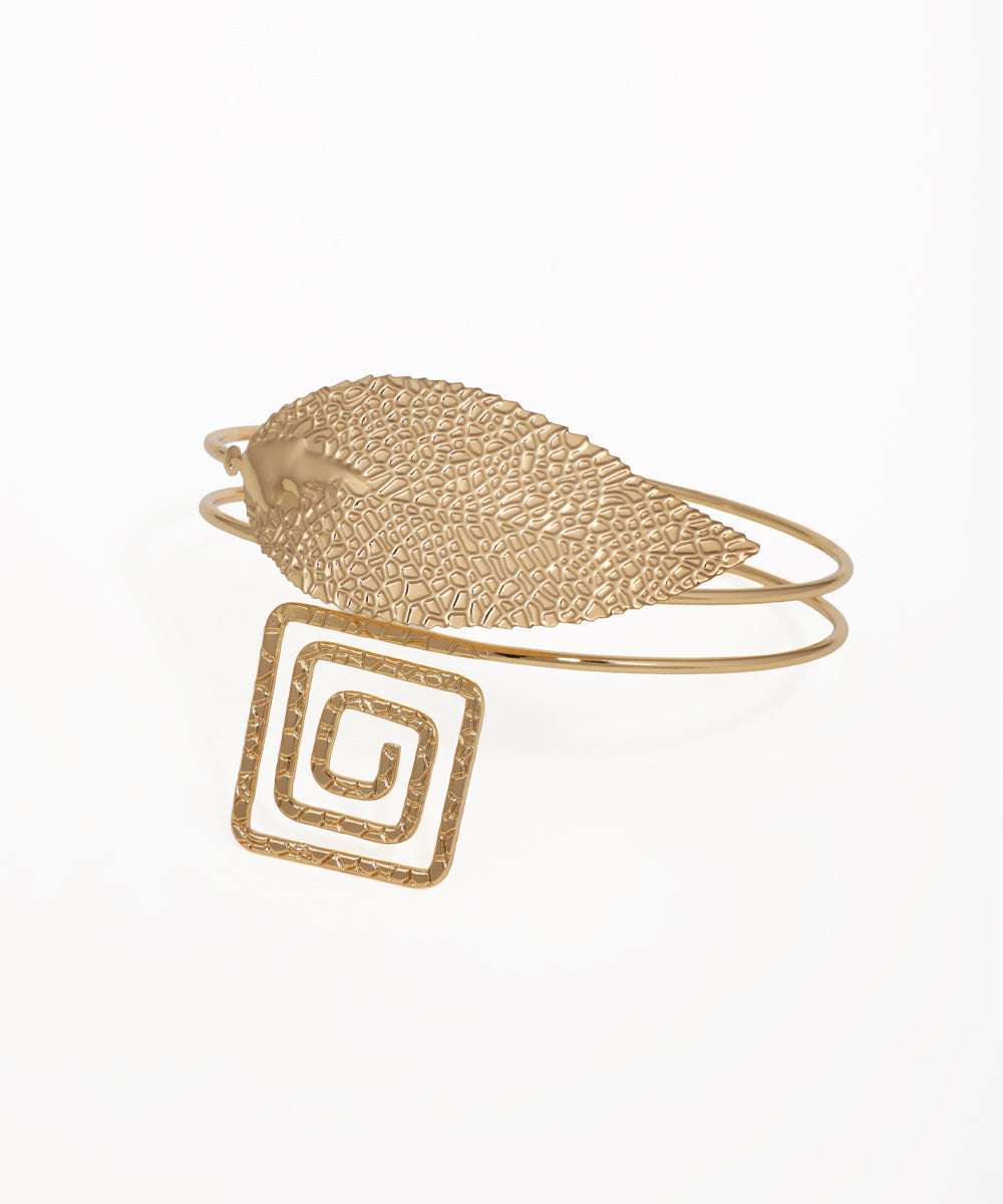 Gold-tone arm cuff with textured leaf and square spiral design