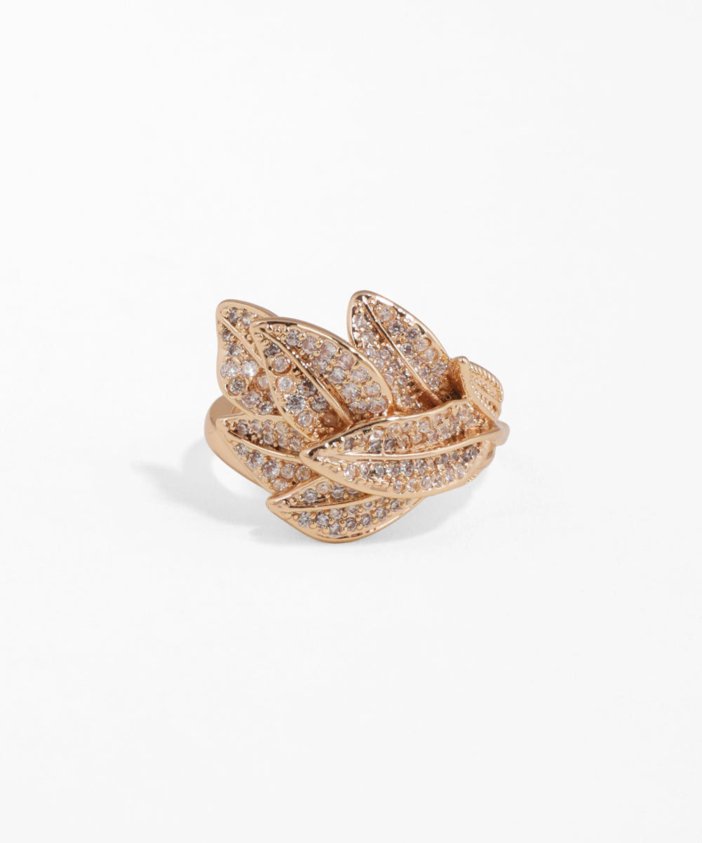 Rose gold ring with diamond accents on a white background