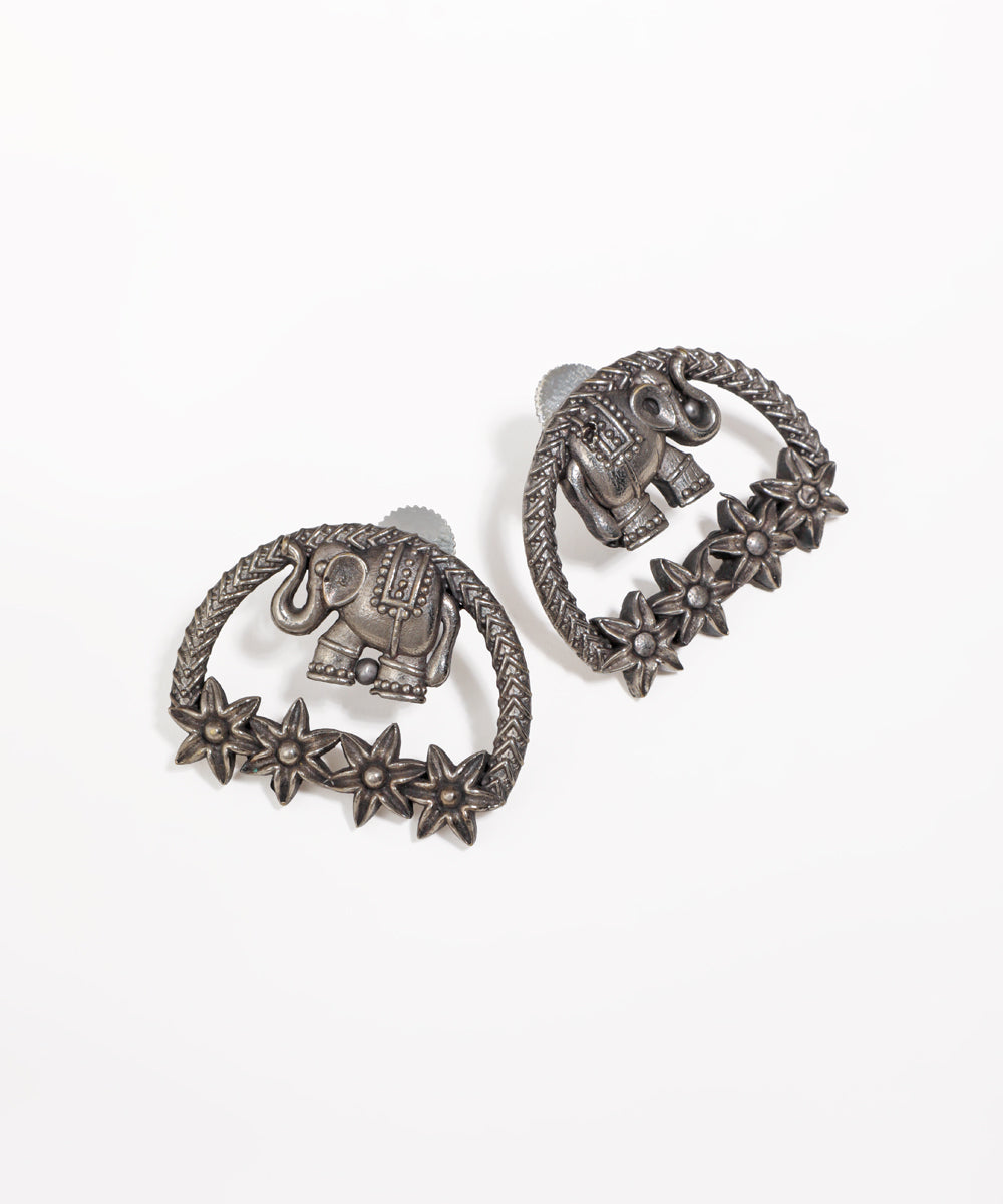 Oxidised earrings with an elephant motif and star-shaped floral details