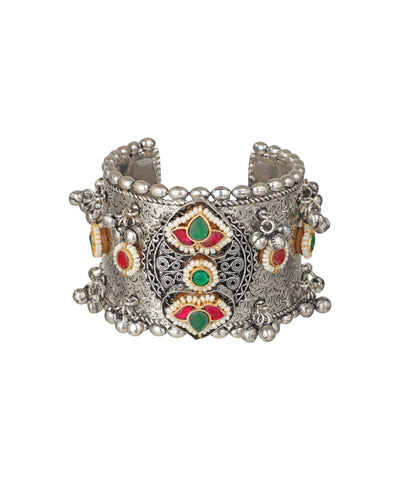 Oxidized silver-tone cuff bracelet with red and green stones, faux pearls, and dangle beads