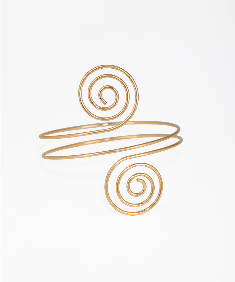 Gold-tone arm cuff with open spiral design at each end