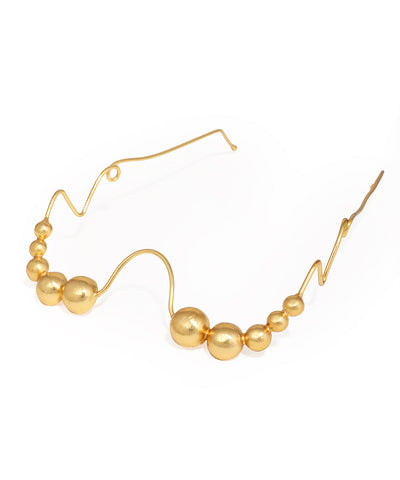 Gold-tone facelet with organic wavy design and graduated matte beads