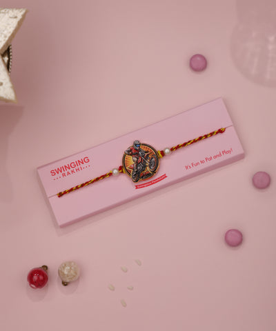 Multicolor finish Rakhi with motorcycle rider charm and faux pearls