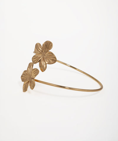 Elegant floral wrap arm bracelet with textured blossom accents