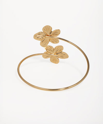 Twin flower arm cuff with sculpted petal detailing and gold-tone finish