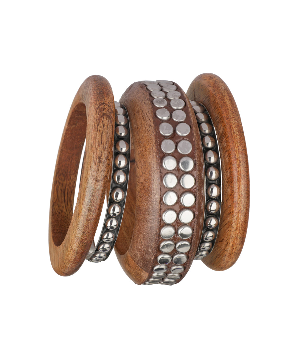 Layered cylindrical bangle silhouette with wood elements