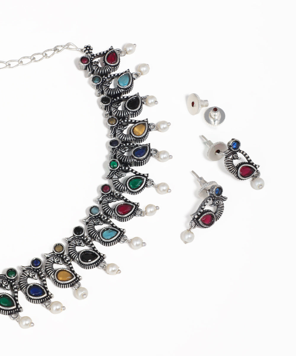 Peacock motif oxidised necklace set with multicolor stones, pearl drops and matching earrings
