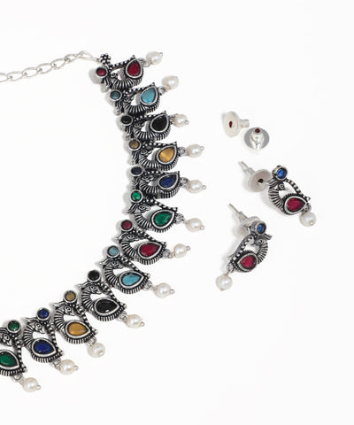 Peacock motif oxidised necklace set with multicolor stones, pearl drops and matching earrings