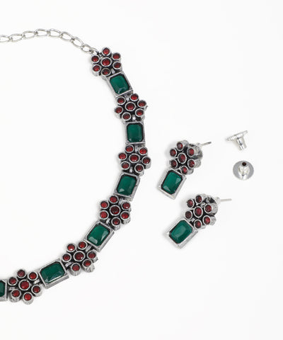 Vintage-inspired floral oxidised necklace and earrings set with gemstone accents