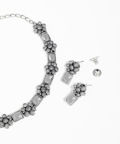 Intricate floral oxidised necklace set with multicolor stone accents and matching earrings
