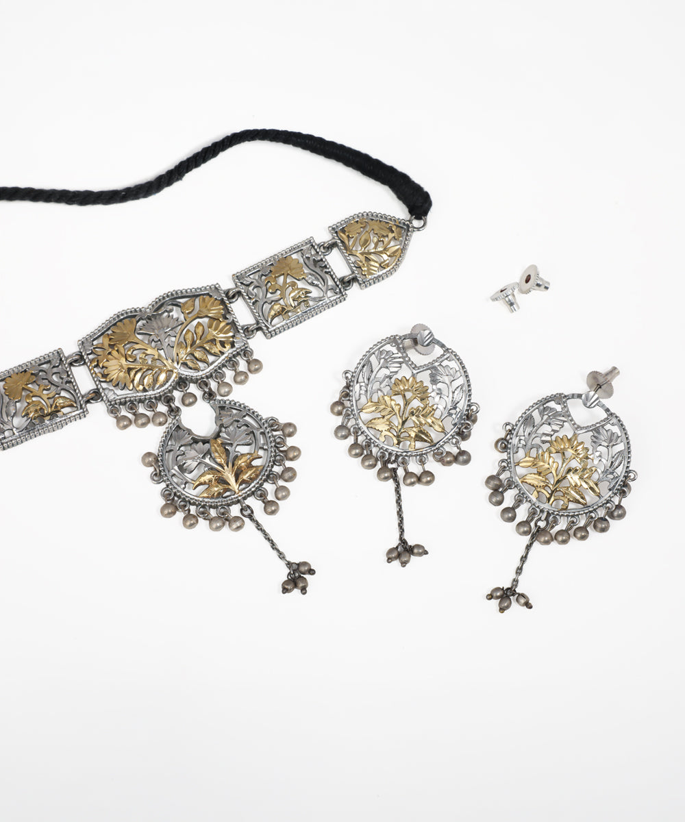Dual-tone floral oxidised necklace set with intricate filigree detailing and matching dangle earrings