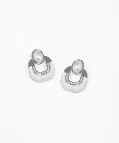 Gold-tone stud earrings featuring an elegant Art Deco arch motif