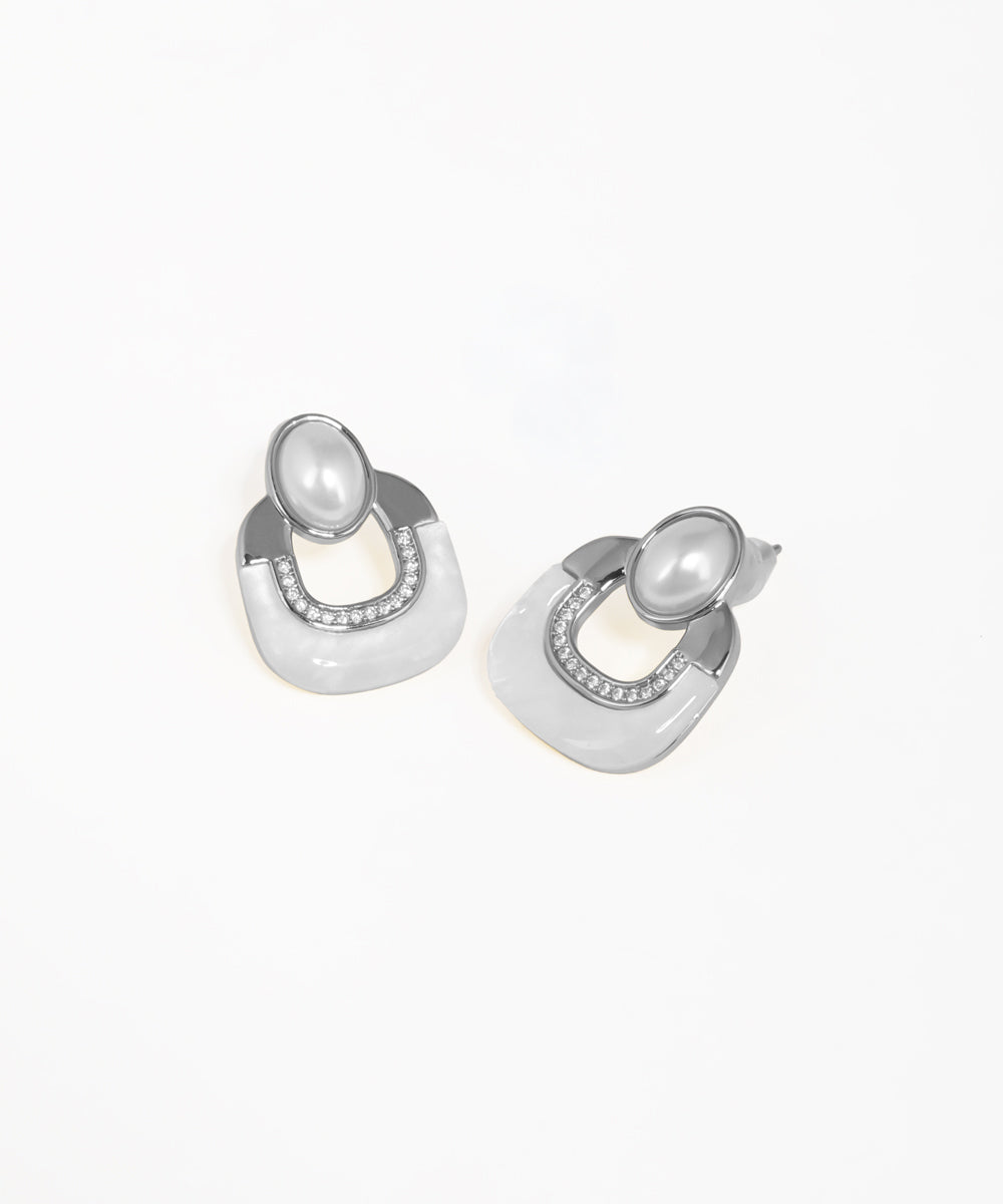 Statement geometric earrings with crystal embellishments and arch silhouette