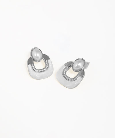 Statement geometric earrings with crystal embellishments and arch silhouette