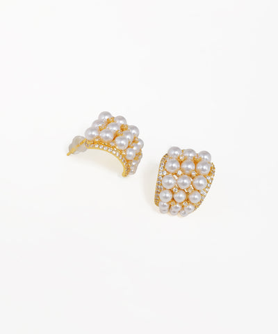 Crescent pearl cluster stud earrings with gold-tone finish and crystal accents