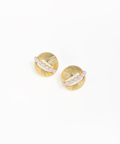 Pair of gold earrings with pearl-like stones on a white background