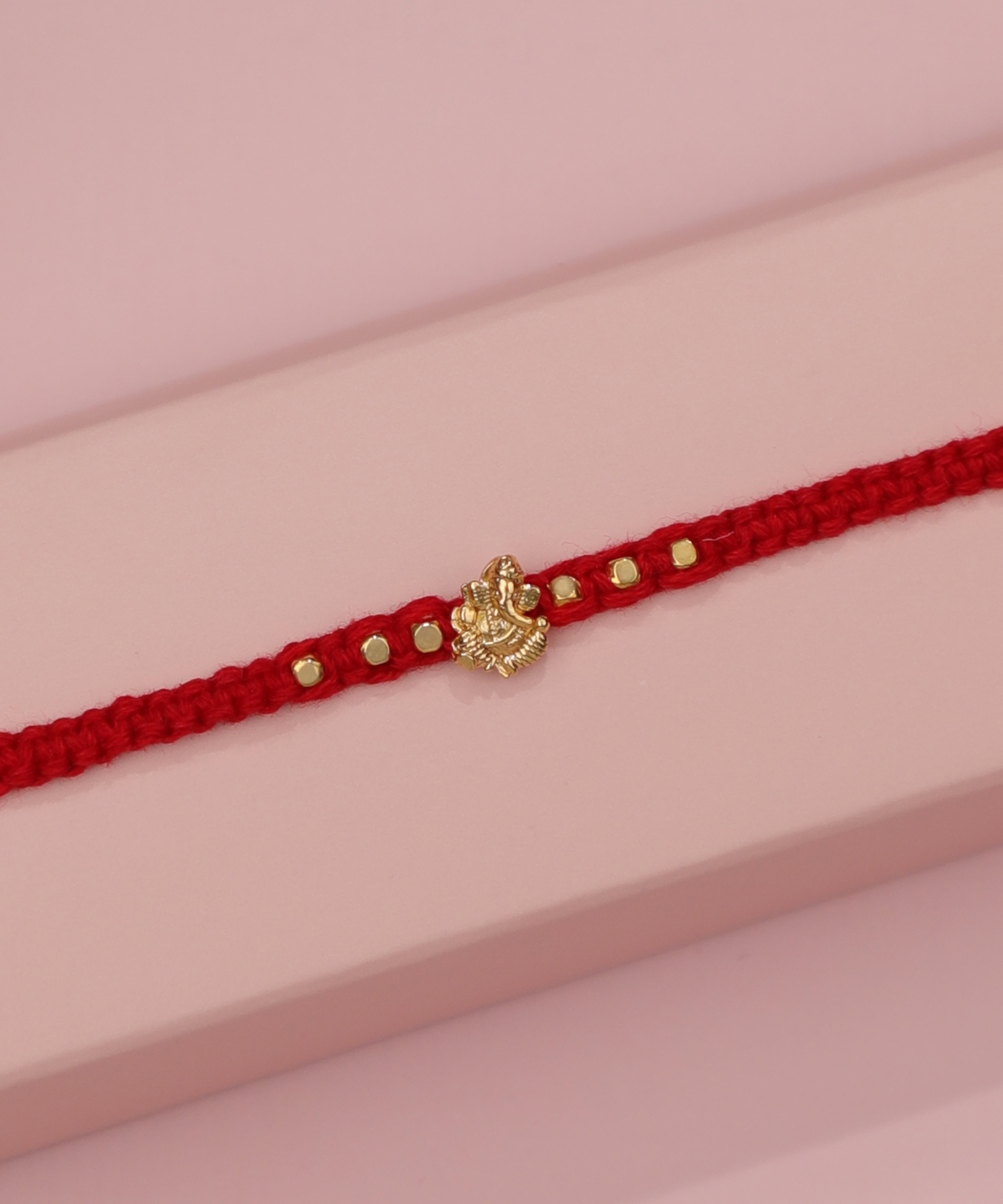 Handcrafted Ganesha Motif Beaded Red Thread Rakhi | Stylika