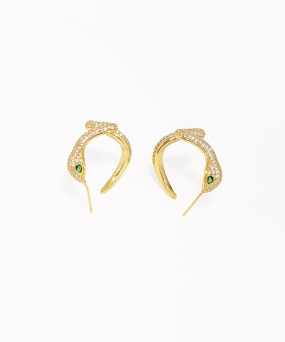 Gold snake stud earrings featuring a wavy design and pavé crystals