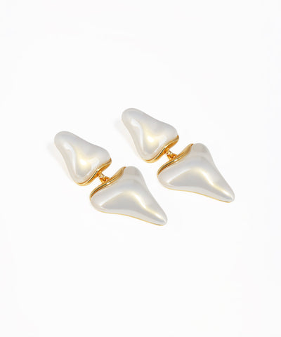 Gold abstract drop earrings featuring layered sculptural shapes