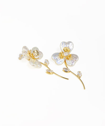 Flower dangler earrings with sculpted petals and polished gold finish