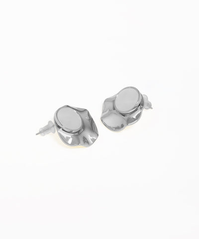 Contemporary stud earrings featuring abstract disc and oval shapes