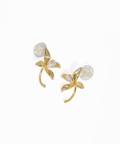 Gold floral drop earrings featuring curved petal design and crystal accents
