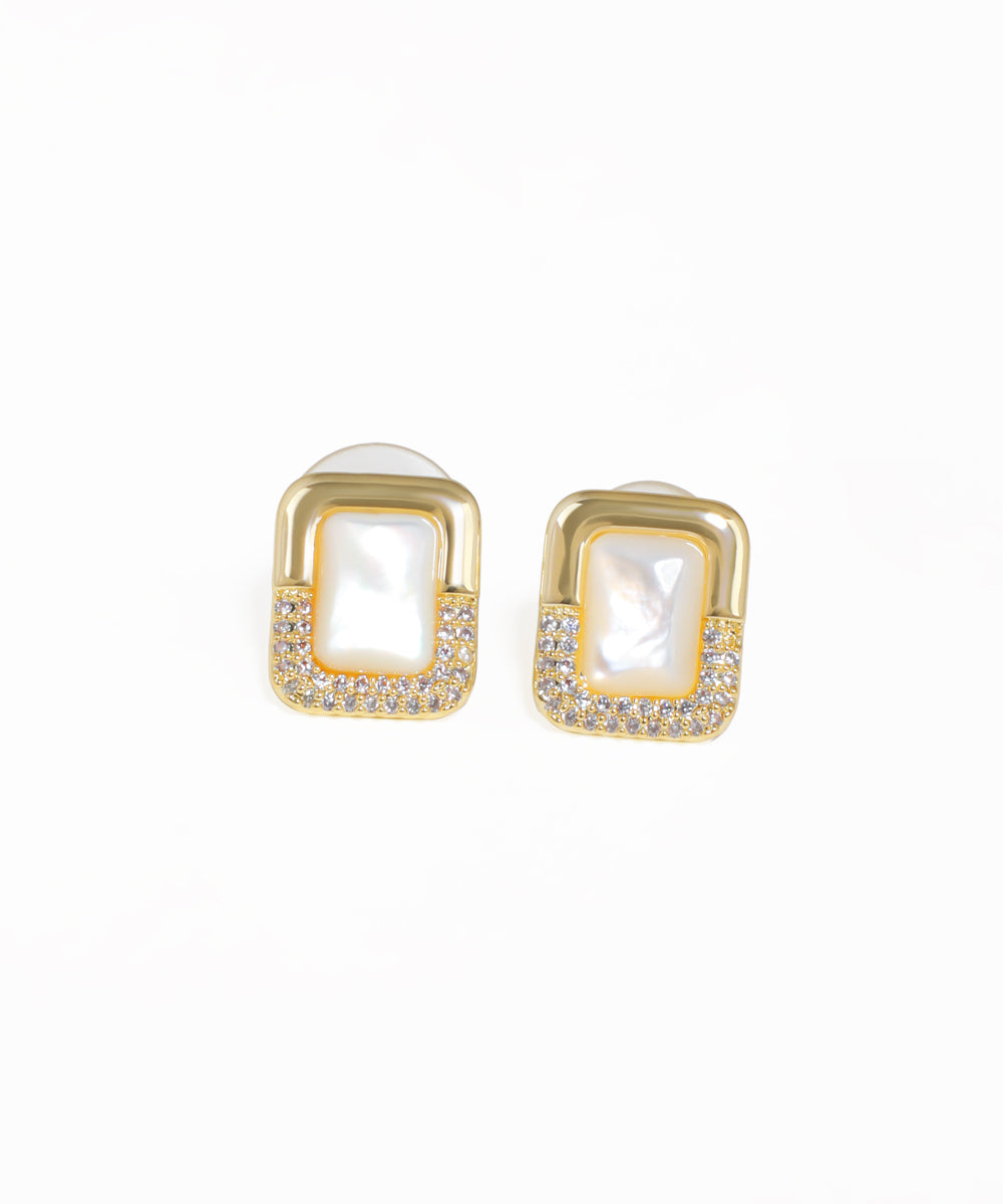 Geometric inlay stud earrings with pavé crystal detailing and gold-tone finish