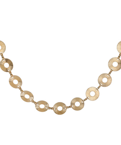 Waist chain with a repeating circular disc silhouette