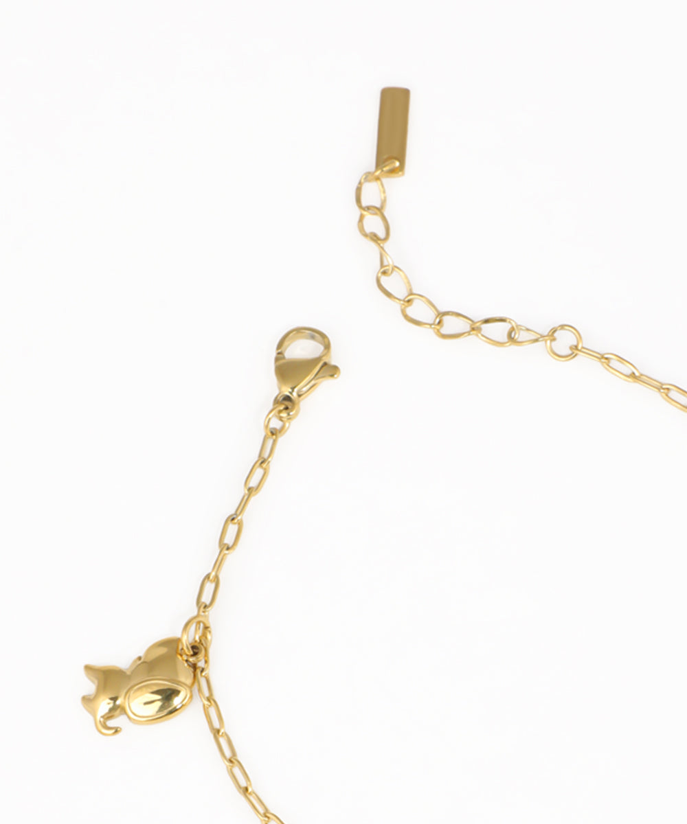 Whimsical animal charm bracelet featuring owl, unicorn and cat charms in gold-tone finish