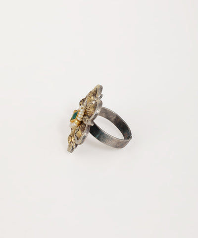 Vintage-inspired oxidised statement ring with floral design and gemstone details