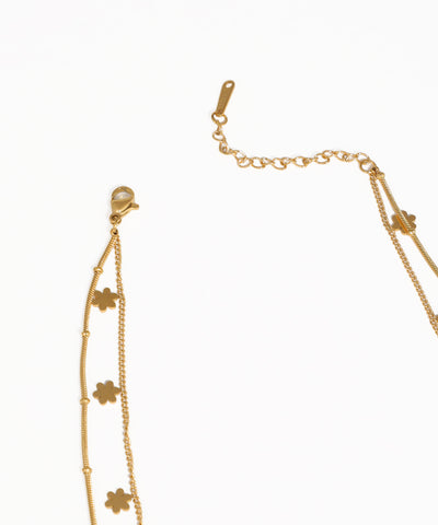 Layered floral pendant necklace with dainty gold chain design