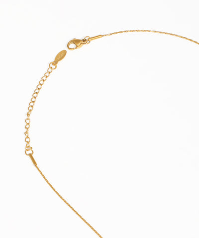 Gold floral pendant necklace with delicate bead accents