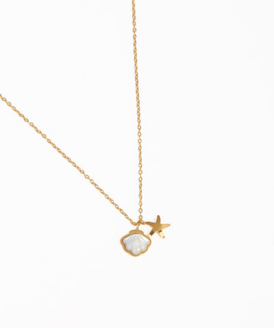 Ocean-inspired shell and star charm necklace with gold-tone chain