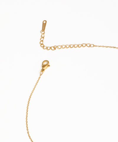 Gold evil eye pendant necklace with boho-inspired charm details
