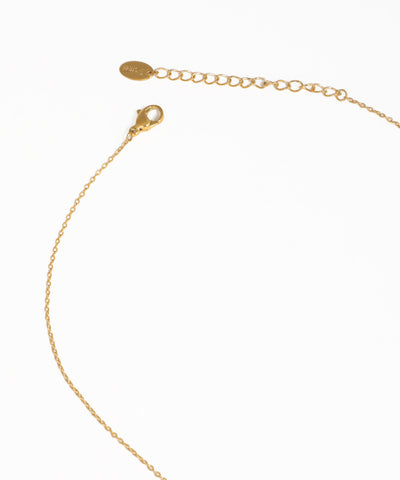Gold charm pendant necklace with sparkling crystal accents