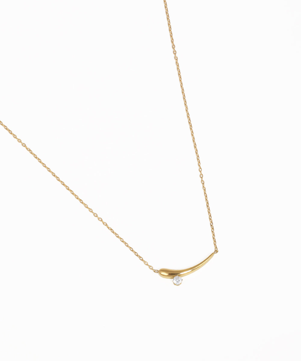 Minimal curved bar pendant necklace with crystal accents and gold-tone chain